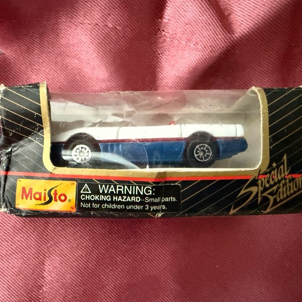 Blue and White Toy Car with Sleek Design and Durable Build
